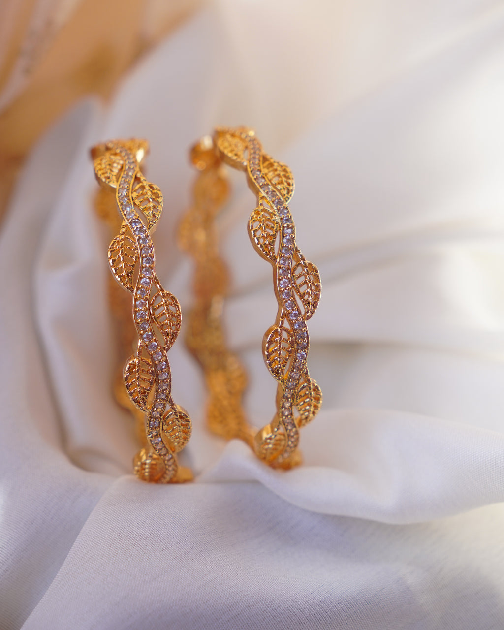 ZORA - Premium 1 Gram Gold Plated Wavy Leaf Bangles | Micro Plated American Diamond Twisted Wave Bracelets Set of 2