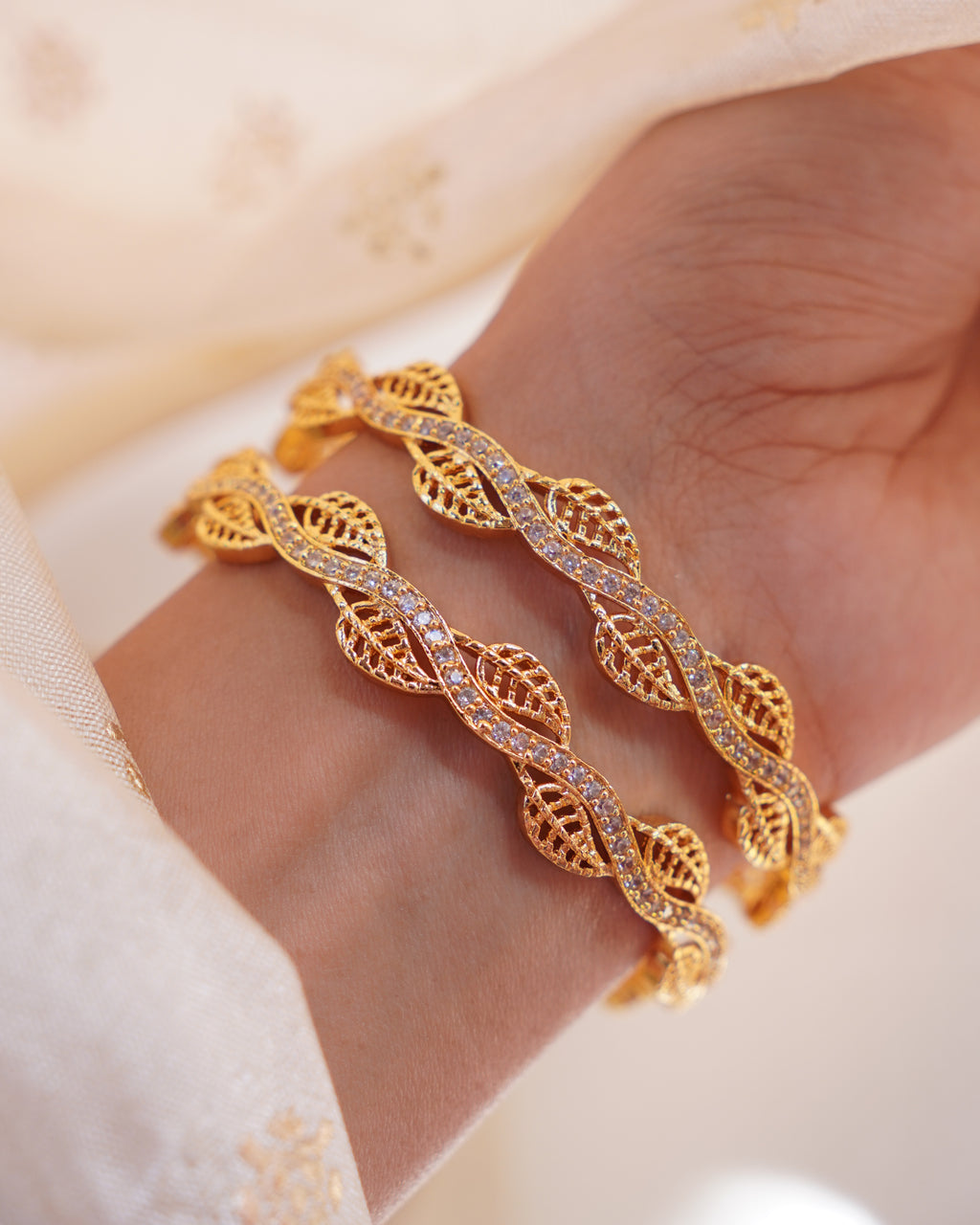 ZORA - Premium 1 Gram Gold Plated Wavy Leaf Bangles | Micro Plated American Diamond Twisted Wave Bracelets Set of 2