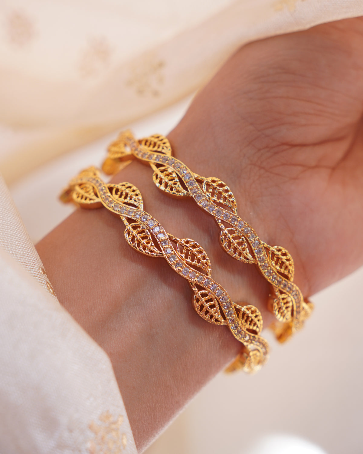 ZORA - Premium 1 Gram Gold Plated Wavy Leaf Bangles | Micro Plated American Diamond Twisted Wave Bracelets Set of 2