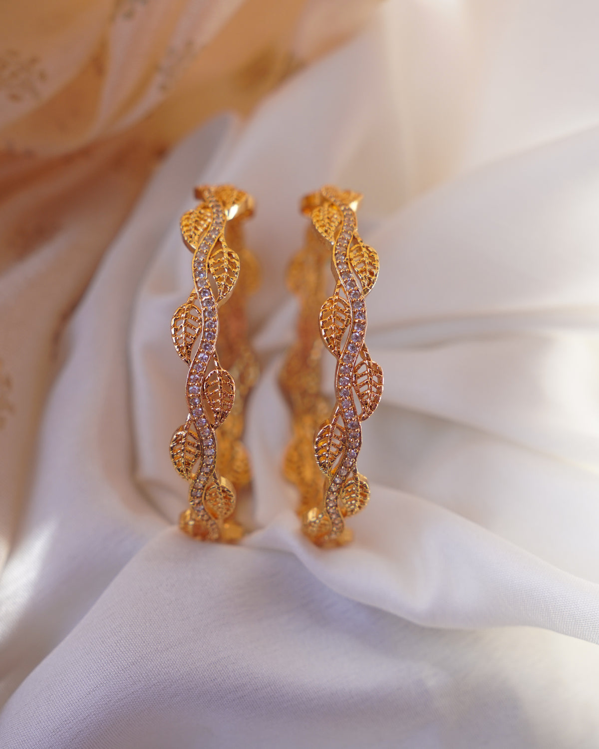 ZORA - Premium 1 Gram Gold Plated Wavy Leaf Bangles | Micro Plated American Diamond Twisted Wave Bracelets Set of 2