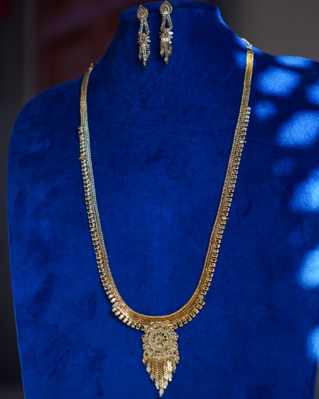 ORO-  Premium 1 Gram Gold Plated Traditional Long Haram Set | Micro Plated Sleek Rani Haar with Central Floral Pendant and Matching Earrings