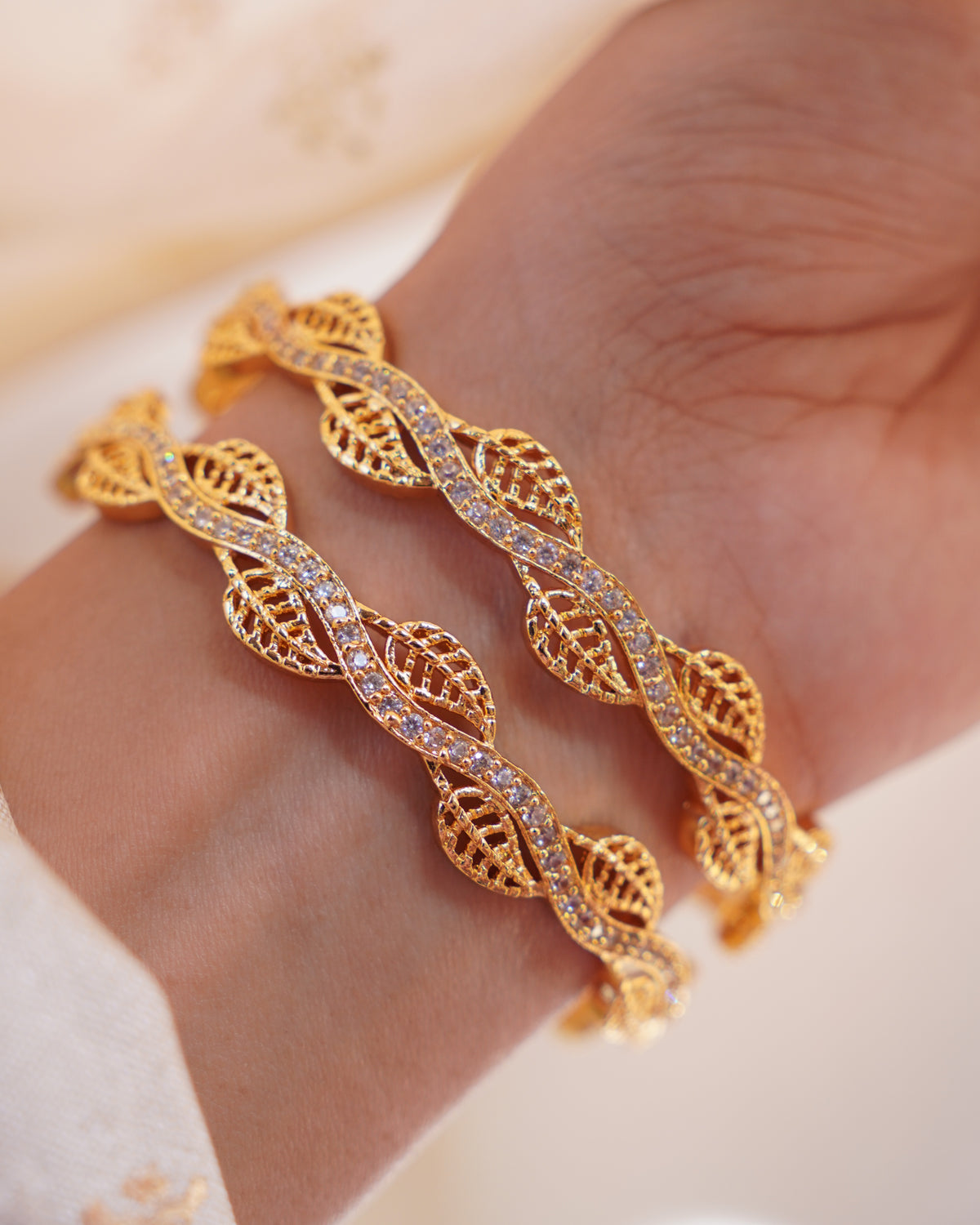 ZORA - Premium 1 Gram Gold Plated Wavy Leaf Bangles | Micro Plated American Diamond Twisted Wave Bracelets Set of 2