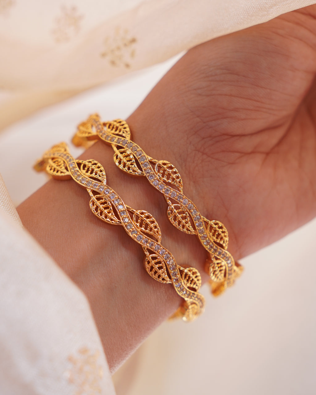ZORA - Premium 1 Gram Gold Plated Wavy Leaf Bangles | Micro Plated American Diamond Twisted Wave Bracelets Set of 2